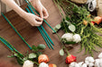 flower lover is using bamboo stakes to DIY the flowers flower arrangement